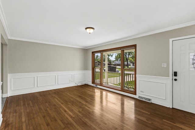 521 N 3rd Ave, Villa Park, IL 60181 - unfurnished room featuring wood finished floors, wainscoting, ornamental molding, and a decorative wall