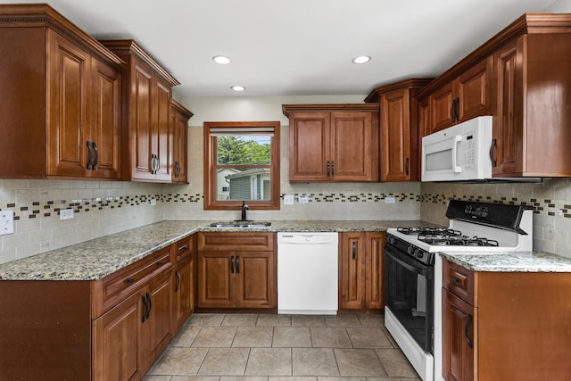 521 N 3rd Ave, Villa Park, IL 60181 - kitchen featuring white appliances, a sink, tasteful backsplash, light stone countertops, and light tile patterned floors