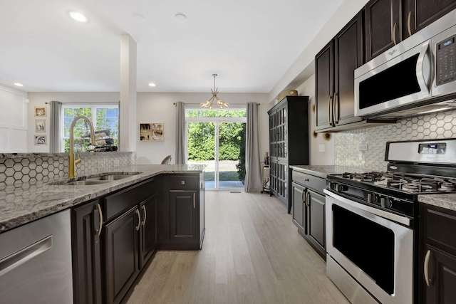 332 Buckingham Ct, Lombard, IL 60148 - kitchen featuring stainless steel appliances, plenty of natural light, light wood-style floors, light stone counters, and recessed lighting