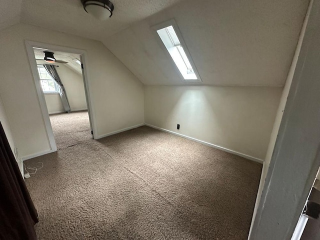 826 N 11th St, Rochelle, IL 61068 - additional living space featuring carpet, vaulted ceiling, and baseboards