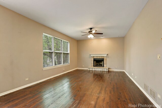 996 Highgate Ln, Grayslake, IL 60030 - unfurnished living room featuring a ceiling fan, dark wood-style flooring, and a fireplace