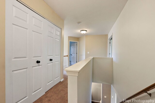 996 Highgate Ln, Grayslake, IL 60030 - hallway featuring dark carpet and an upstairs landing