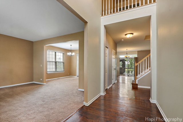 996 Highgate Ln, Grayslake, IL 60030 - entryway with a chandelier, dark wood-type flooring, stairs, and dark carpet