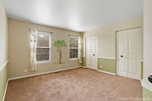 996 Highgate Ln, Grayslake, IL 60030 - unfurnished bedroom with carpet flooring and multiple closets