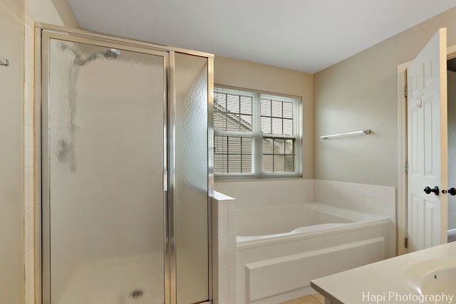 996 Highgate Ln, Grayslake, IL 60030 - bathroom featuring a shower stall, a bath, and vanity