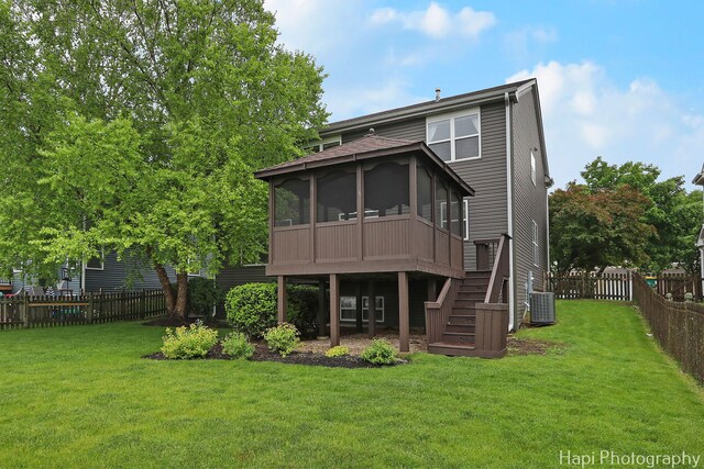 996 Highgate Ln, Grayslake, IL 60030 - back of property with a sunroom, a fenced backyard, and stairs