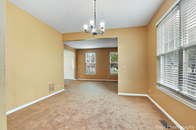 996 Highgate Ln, Grayslake, IL 60030 - unfurnished room with a chandelier and carpet flooring