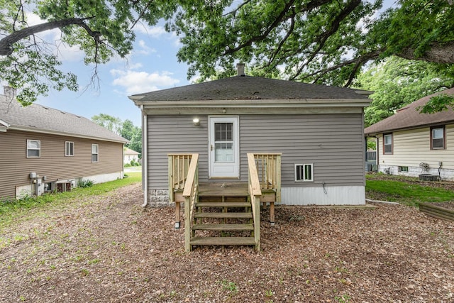 909 Woods Ave, Joliet, IL 60436 - rear view of property with a wooden deck and central AC