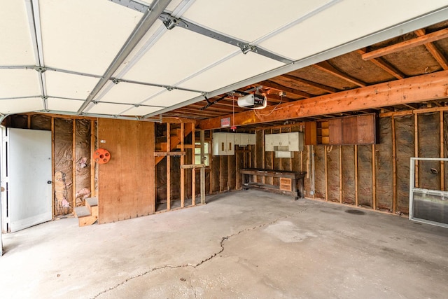 909 Woods Ave, Joliet, IL 60436 - garage featuring a garage door opener