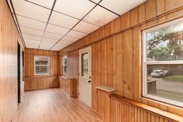 909 Woods Ave, Joliet, IL 60436 - hallway with wooden walls and light wood finished floors