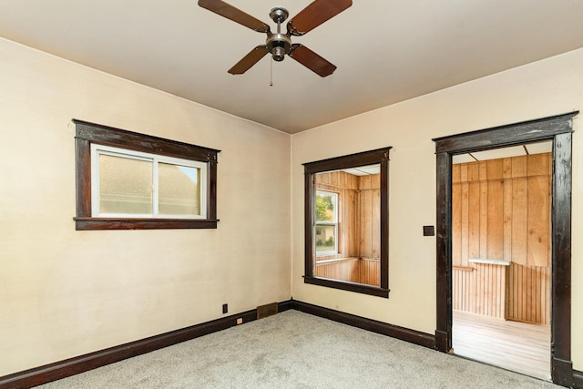 909 Woods Ave, Joliet, IL 60436 - carpeted empty room featuring a ceiling fan and baseboards