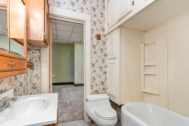 909 Woods Ave, Joliet, IL 60436 - bathroom with wallpapered walls, toilet, vanity, and a drop ceiling