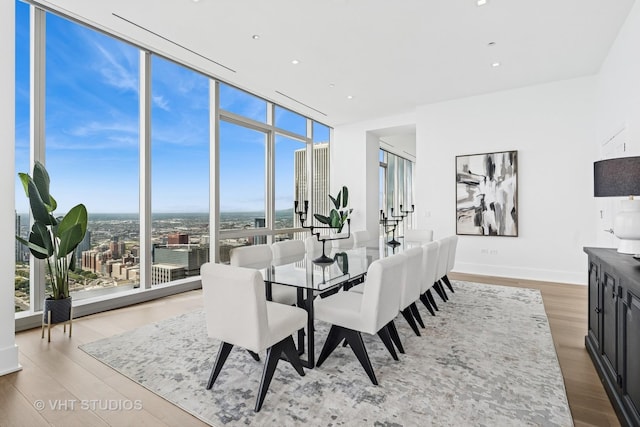 363 E Wacker Dr Unit 7501, Chicago, IL 60601 - dining area featuring floor to ceiling windows, wood finished floors, baseboards, and recessed lighting