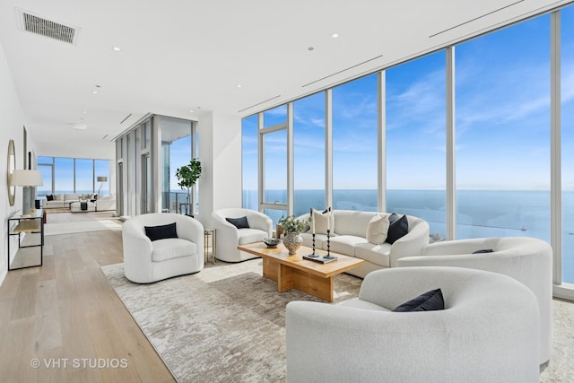 363 E Wacker Dr Unit 7501, Chicago, IL 60601 - living room featuring expansive windows, wood finished floors, and a water view