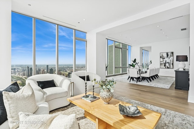 363 E Wacker Dr Unit 7501, Chicago, IL 60601 - living room with wood finished floors, floor to ceiling windows, and recessed lighting