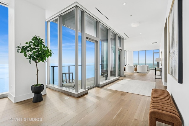 363 E Wacker Dr Unit 7501, Chicago, IL 60601 - corridor featuring floor to ceiling windows, wood finished floors, and a water view
