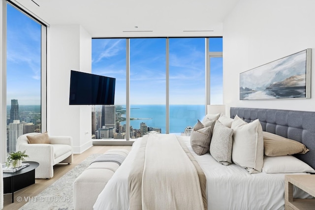 363 E Wacker Dr Unit 7501, Chicago, IL 60601 - bedroom featuring a wall of windows and wood finished floors