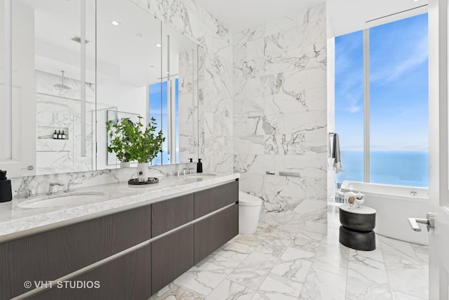 363 E Wacker Dr Unit 7501, Chicago, IL 60601 - bathroom with toilet, marble tiled floors, and double vanity