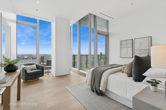 363 E Wacker Dr Unit 7501, Chicago, IL 60601 - bedroom with light wood-type flooring and floor to ceiling windows