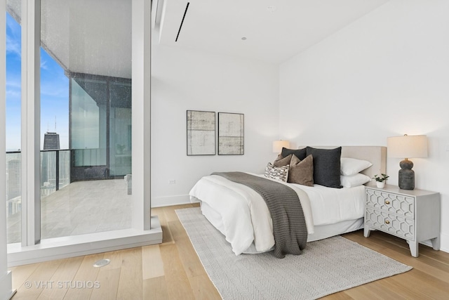 363 E Wacker Dr Unit 7501, Chicago, IL 60601 - bedroom with wood finished floors and floor to ceiling windows