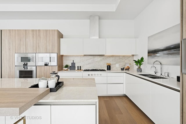 363 E Wacker Dr Unit 7501, Chicago, IL 60601 - kitchen featuring a sink, modern cabinets, light countertops, tasteful backsplash, and white cabinets