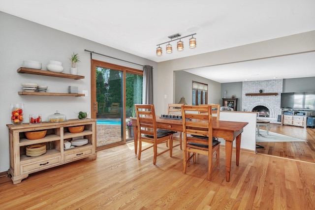 19415 Lisadell Dr, Tinley Park, IL 60487 - dining room featuring light wood-style floors and a brick fireplace