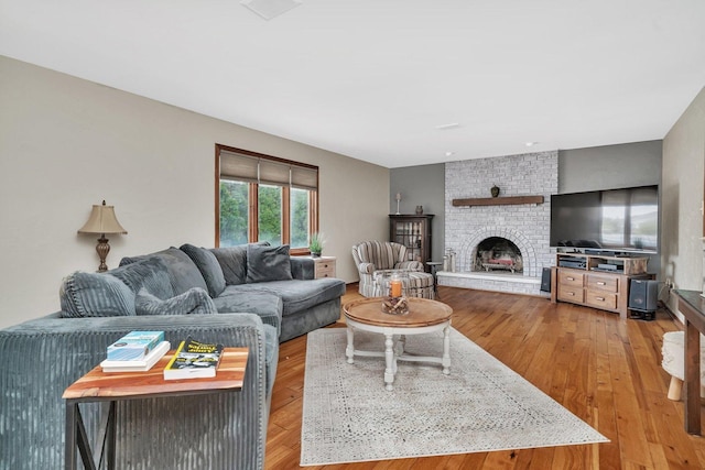 19415 Lisadell Dr, Tinley Park, IL 60487 - living room with light wood finished floors and a brick fireplace