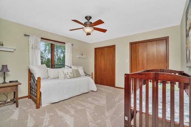 19415 Lisadell Dr, Tinley Park, IL 60487 - bedroom featuring baseboards, multiple closets, light colored carpet, and ceiling fan
