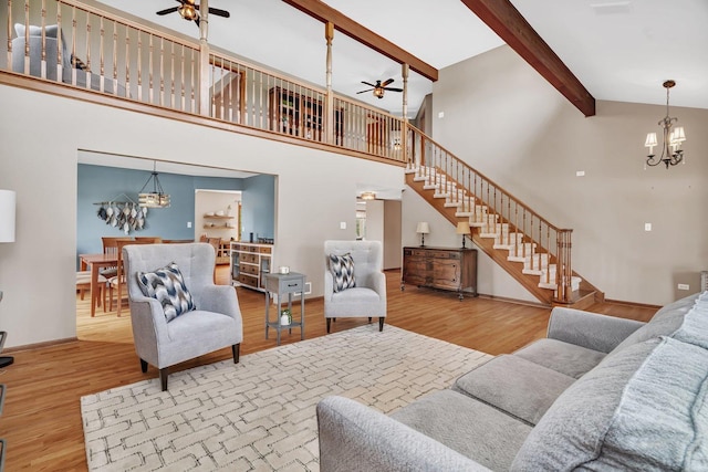 19415 Lisadell Dr, Tinley Park, IL 60487 - living area featuring a ceiling fan, a chandelier, stairs, wood finished floors, and high vaulted ceiling