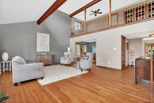 19415 Lisadell Dr, Tinley Park, IL 60487 - living room featuring wood finished floors, ceiling fan, beam ceiling, healthy amount of natural light, and high vaulted ceiling