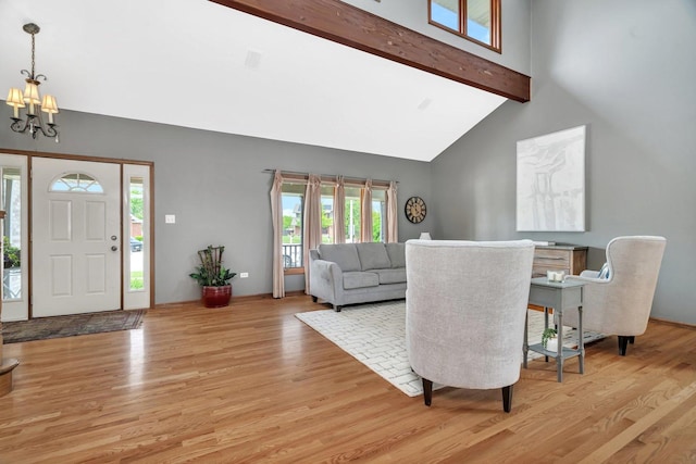 19415 Lisadell Dr, Tinley Park, IL 60487 - living room with beamed ceiling, a chandelier, light wood-style flooring, and high vaulted ceiling