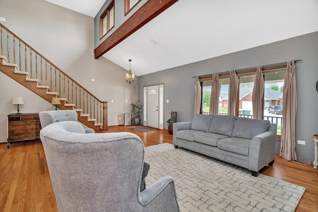 19415 Lisadell Dr, Tinley Park, IL 60487 - living room with stairs, light wood-style flooring, beamed ceiling, high vaulted ceiling, and a chandelier