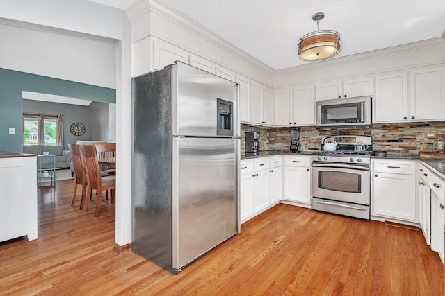 19415 Lisadell Dr, Tinley Park, IL 60487 - kitchen featuring stainless steel appliances, dark countertops, white cabinetry, backsplash, and ornamental molding
