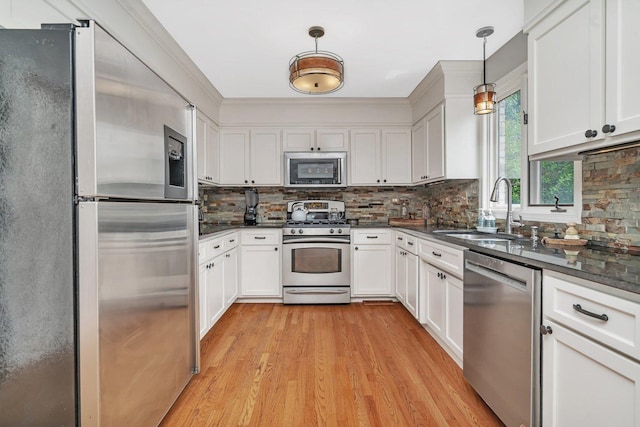 19415 Lisadell Dr, Tinley Park, IL 60487 - kitchen with appliances with stainless steel finishes, a sink, dark countertops, and white cabinets