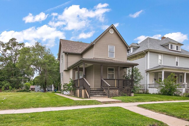 175 N Washington Ave, Kankakee, IL 60901 - view of front of property featuring covered porch, a front lawn, and roof with shingles