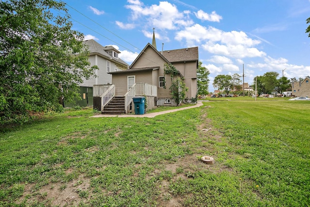 175 N Washington Ave, Kankakee, IL 60901 - back of house with a lawn and a wooden deck