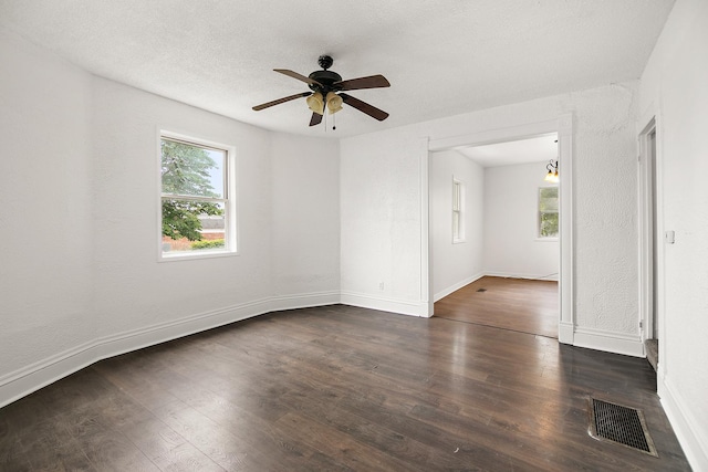 175 N Washington Ave, Kankakee, IL 60901 - unfurnished room with dark wood finished floors, a ceiling fan, and baseboards