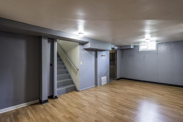 1101 Pine St, Waukegan, IL 60085 - basement featuring light wood-type flooring, stairs, and baseboards