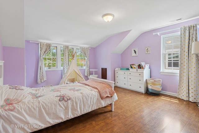 720 Beaver Rd, Glenview, IL 60025 - bedroom with vaulted ceiling, wood finished floors, and baseboards