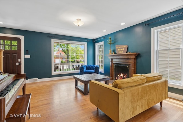 720 Beaver Rd, Glenview, IL 60025 - living area featuring a lit fireplace, baseboards, wood finished floors, and recessed lighting