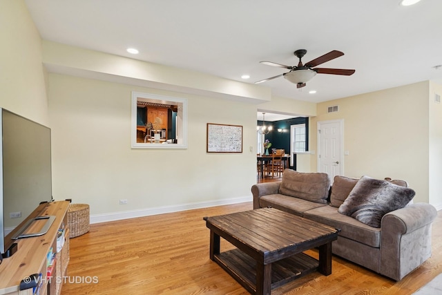 720 Beaver Rd, Glenview, IL 60025 - living room featuring recessed lighting, a ceiling fan, light wood finished floors, a chandelier, and baseboards