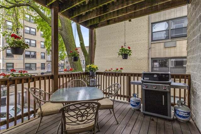 1237 W Farwell Ave Unit 2W, Chicago, IL 60626 - wooden deck with area for grilling and outdoor dining area
