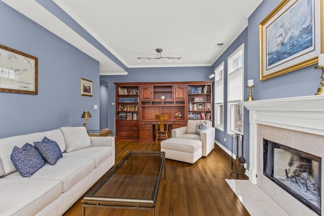1237 W Farwell Ave Unit 2W, Chicago, IL 60626 - living room featuring a fireplace, dark wood-style floors, baseboards, and crown molding