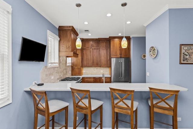1237 W Farwell Ave Unit 2W, Chicago, IL 60626 - kitchen featuring high quality fridge, a peninsula, backsplash, light countertops, and recessed lighting