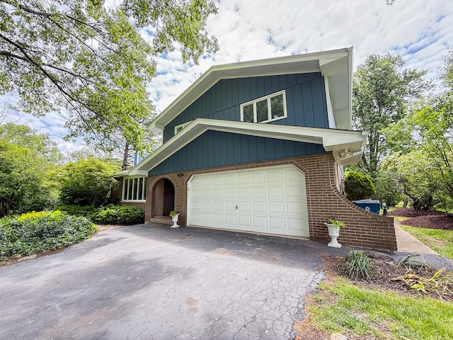 12533 S Iroquois Rd, Palos Park, IL 60464 - view of front of home with brick siding, asphalt driveway, and an attached garage