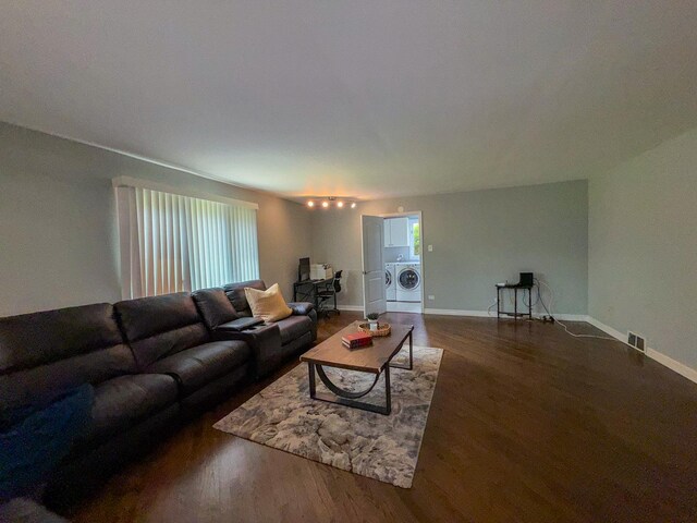 12533 S Iroquois Rd, Palos Park, IL 60464 - living room featuring washing machine and dryer, wood finished floors, and baseboards