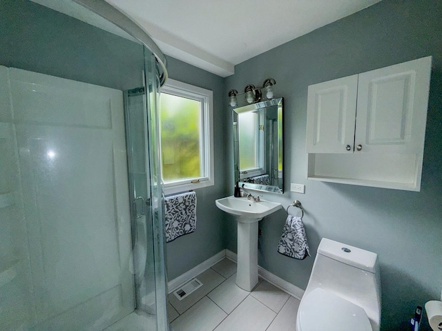 12533 S Iroquois Rd, Palos Park, IL 60464 - bathroom with tile patterned flooring, toilet, a shower stall, a sink, and baseboards