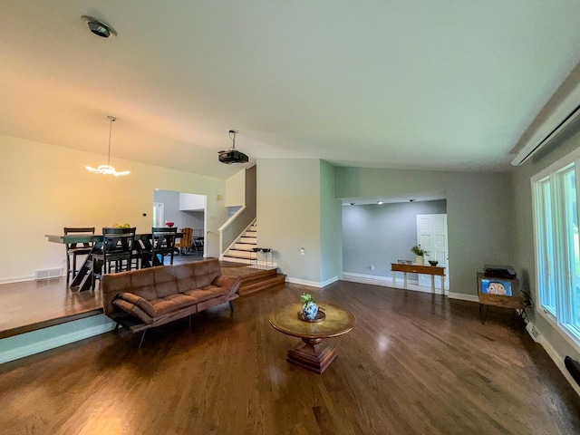 12533 S Iroquois Rd, Palos Park, IL 60464 - living room featuring stairway, wood finished floors, a chandelier, baseboards, and vaulted ceiling
