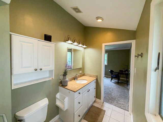 12533 S Iroquois Rd, Palos Park, IL 60464 - bathroom featuring vanity, vaulted ceiling, toilet, tile patterned flooring, and baseboards