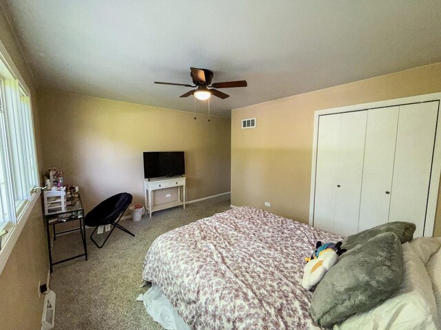 12533 S Iroquois Rd, Palos Park, IL 60464 - bedroom featuring carpet, a closet, ceiling fan, and multiple windows
